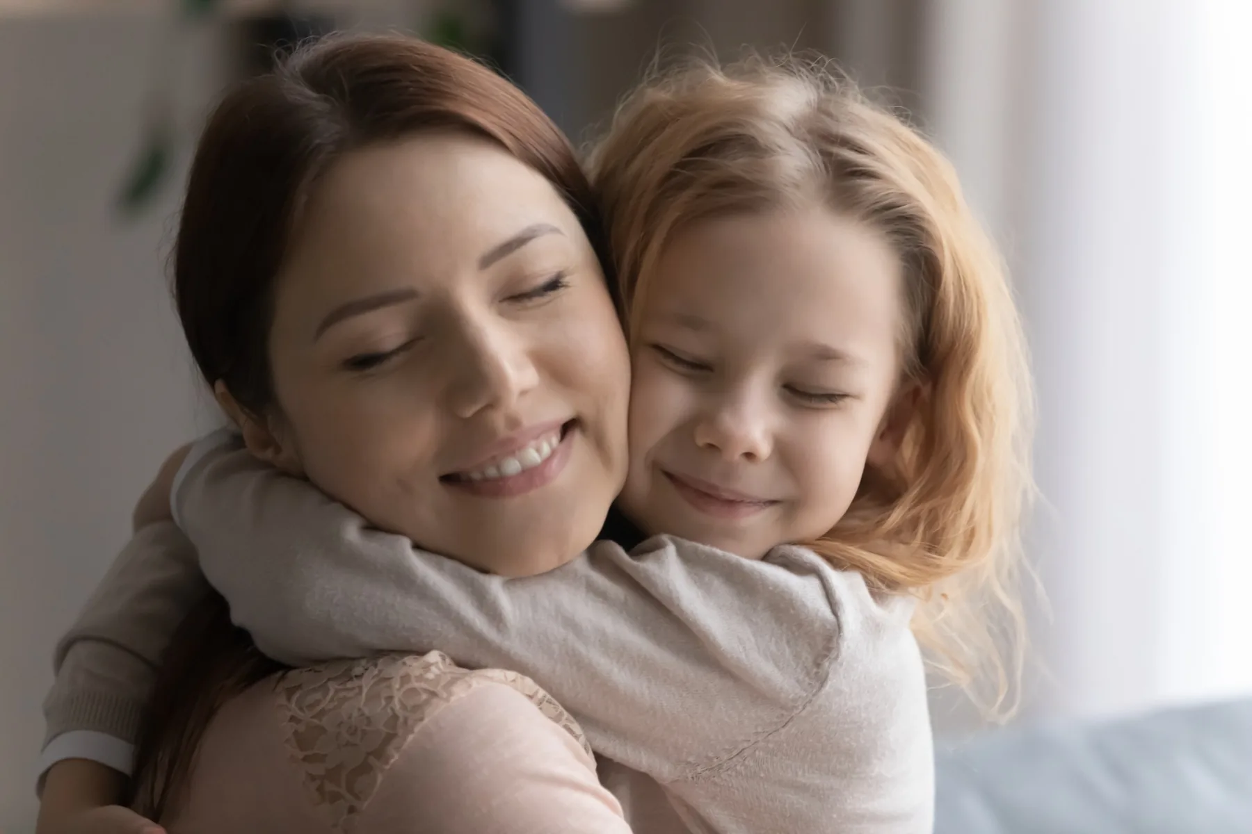 Mother and daughter embracing